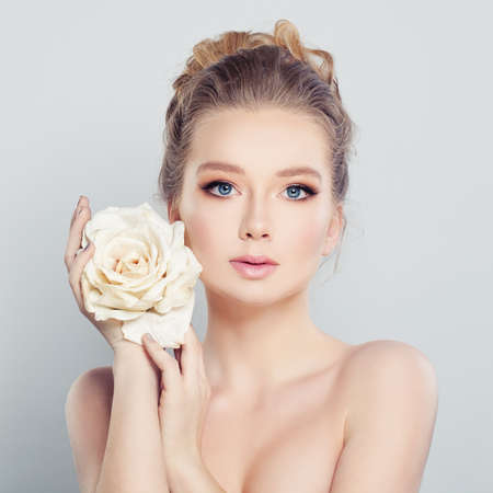 Young Woman with White Rose.の写真素材