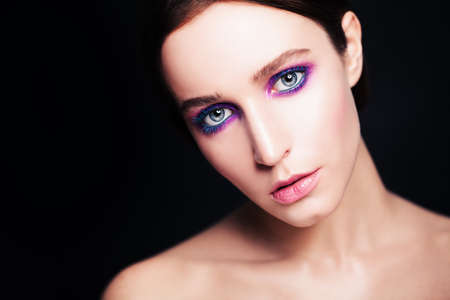 Fashion Model with Bright Make-up on Darkの写真素材