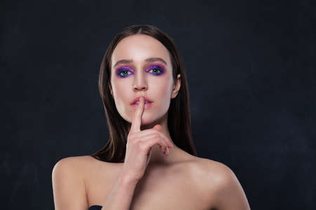 Sensual Woman with Finger on Lips, Silenceの写真素材