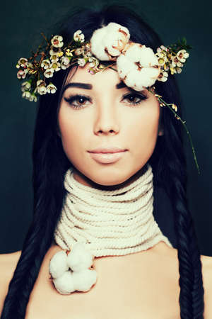Pretty Woman with Long Black Hair and Flowers Crown.の写真素材