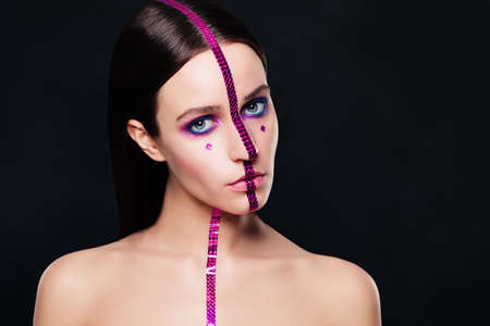 Fashion Model with Creative Makeup on Black Backgroundの写真素材