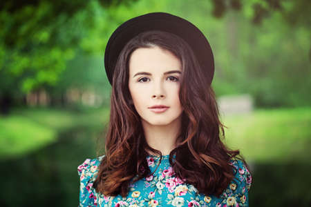 Fashion Model Girl on Green Background Outdoorsの写真素材