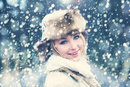 Winter Woman on Snow Winter Backgroundの写真素材
