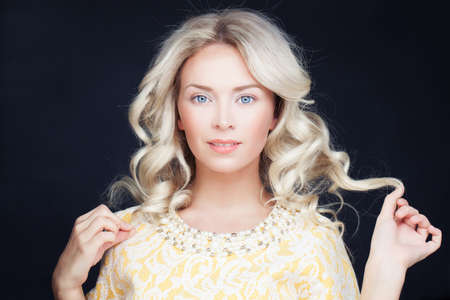 Perfect Woman with Blonde Curly Hair. Wavy Hairstyleの写真素材