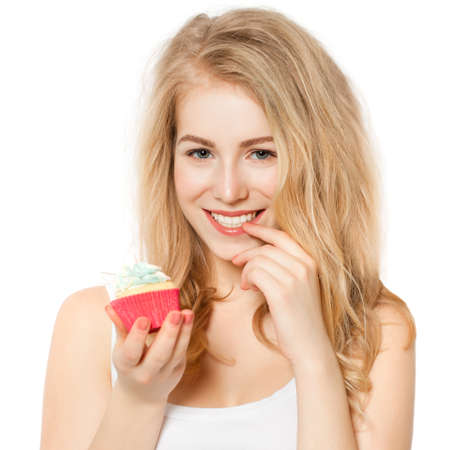 Woman eating cake on whiteの写真素材