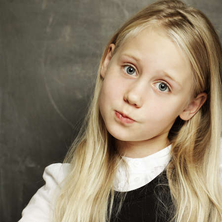 Cute girl - pupil at school