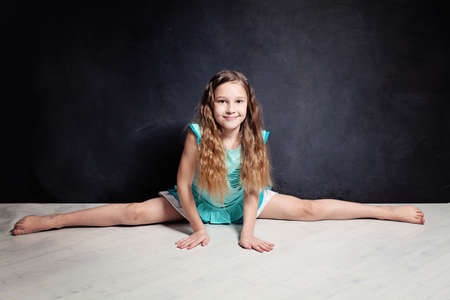 Teenager Girl Posing in Gymnastic Twineの写真素材