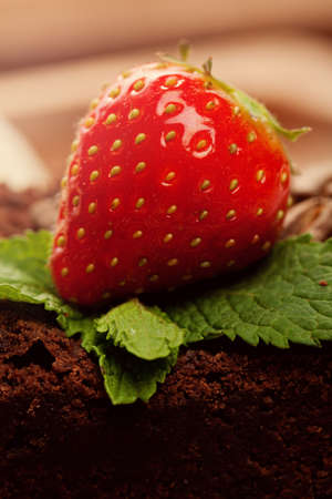 Strawberry on chocolate cake macroの写真素材