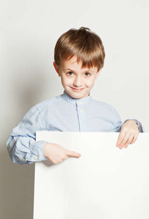 Boy and empty billboardの写真素材