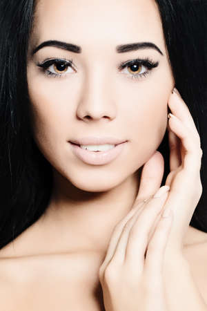 Brunette Woman. Face and Hand closeup. Spa Beautyの写真素材