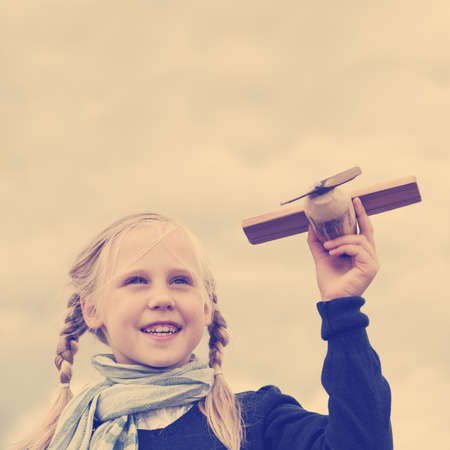 Young girl outdoors under the skyの写真素材