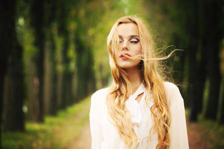 Beautiful Girl with Blond Windy Hair.の写真素材