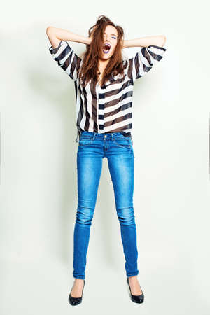 Standing Woman Fashion Model with Open Mouthの写真素材