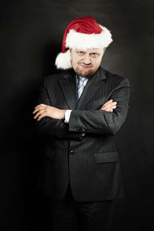 Man in Santa Hat on Dark Backgroundの写真素材