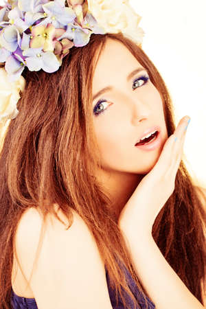 Pretty Woman Fashion Model. Beautiful Ripple Hairstyle with Flowersの写真素材