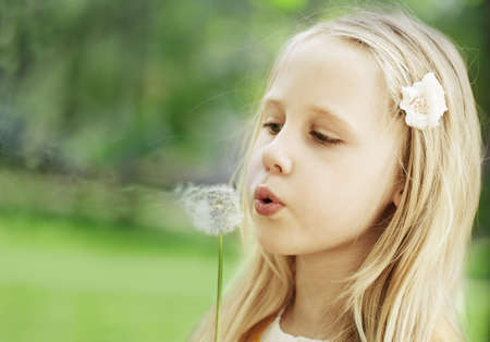 Little girl on green backgroundの写真素材