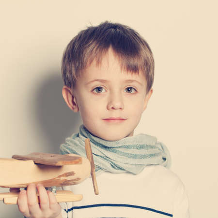 Cute child boy with toys, portraitの写真素材
