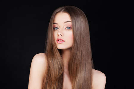 Beautiful Lady with Long Hair on Black Backgroundの写真素材