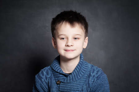 Portrait of Child Boy on Dark Backgroundの写真素材