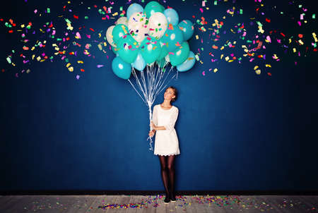 Happy Woman, Balloons and Confetti on Blue Banner Background with Copy Spaceの写真素材