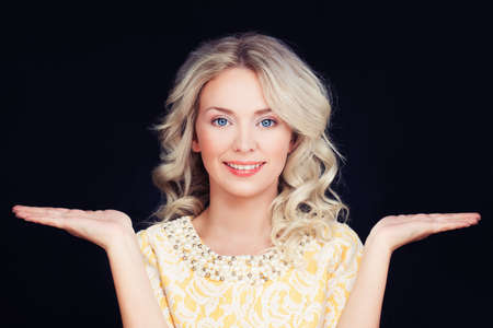 Friendly Woman smiling and showing her hands.の写真素材