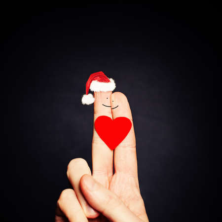 Happy Couple Fingers in Santa Hat with Heart