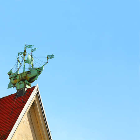Travel concept - sailing ship against deep blue sky. Roof in old town, Germany, Munichの写真素材