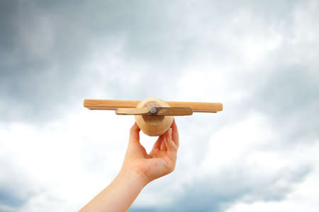 Airplane toy in the cloudy skyの写真素材