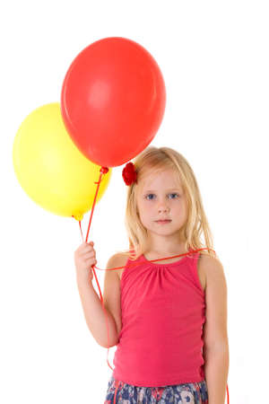 Little girl with balloons isolated on whiteの写真素材