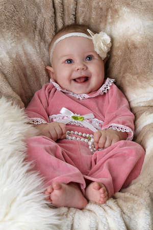 Smiling baby on a beautiful backgroundの写真素材