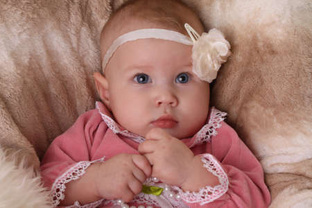 baby girl with flower headbandの写真素材
