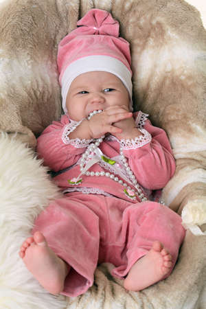 Beautiful newborn baby girl on vintage backgroundの写真素材