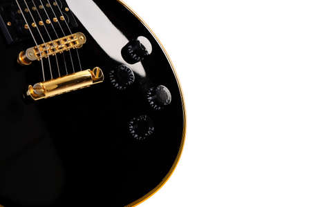 Black electric guitar close-up - art musical backgroundの写真素材