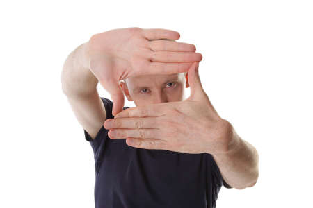 man designer creates a frame with her hands. Focus on handの写真素材