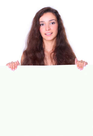 Beautiful young woman holding empty white boardの写真素材