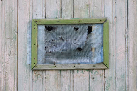 old window and gray wooden wall background