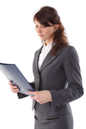 Businesswoman looks at the folder. Isolated on white. Seriesの写真素材