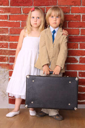 Little bride and groom with copyspace on suitcase. Honeymoon. Seriesの写真素材