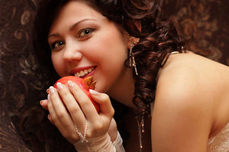 smiling beautiful fiancee with a grenade in the handsの写真素材