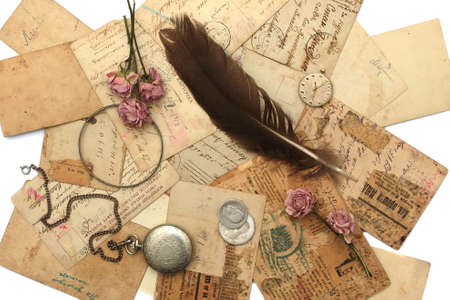 Vintage background with old watch, postcards, photographs and flowersの写真素材