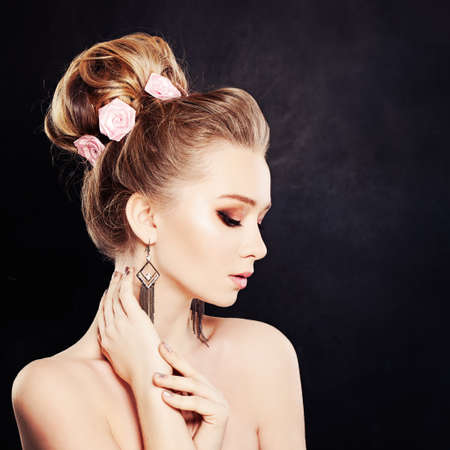 Healthy Woman with Makeup and Bridal Hairstyle with Rose Flowersの写真素材