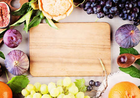 Fruit Frame and Wooden Board. Healthy Food Backgroundの写真素材
