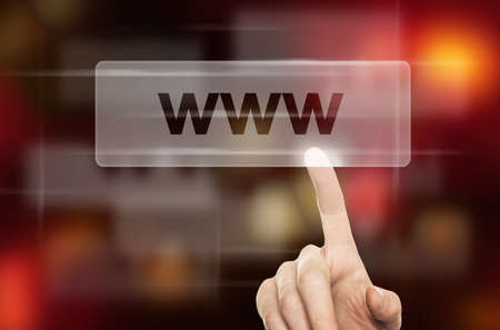WWW Concept and Male Hand Pressing a Web Button on Blurred Abstract Backgroundの写真素材