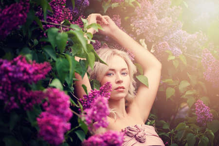 Beauty Portrait of Beautiful Model Woman on Floral Backgroundの写真素材