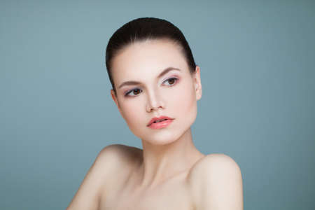 Spa Model Woman with Healthy Skin on Blue Background. Spa Beauty, Facial Treatment and Cosmetology Conceptの写真素材