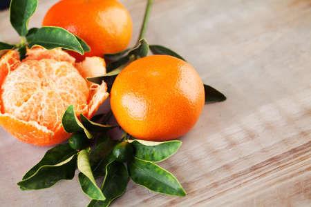 Mandarin Fruits on Wooden Deck Backgroundの写真素材