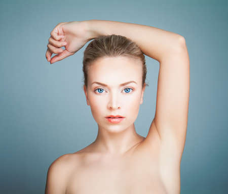 Perfect Spa Model Girl with Healthy Skin on Blue Background. Spa Beauty Portraitの写真素材