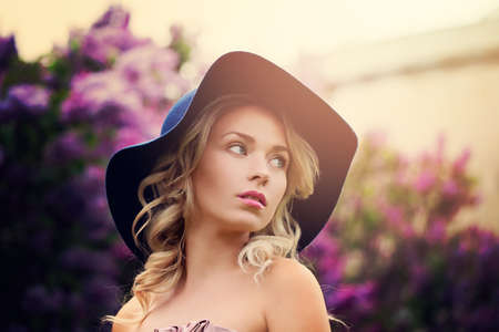 Beautiful Woman with Blonde Hair at Spring Night Outdoorsの写真素材