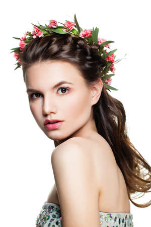 Young Woman Fashion Model with Prom Hairstyle, Makeup and Flowers Isolatedの写真素材