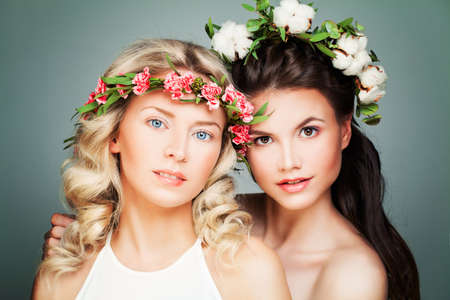 Two Beautiful Women with Long Curly Hair, Perfect Skin and Summeの写真素材